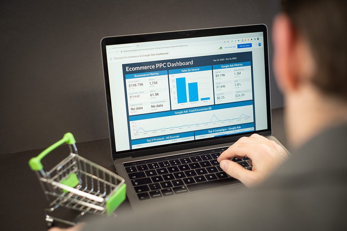 Person reviewing an analytics dashboard on a laptop, a visual for an AI lead pipeline