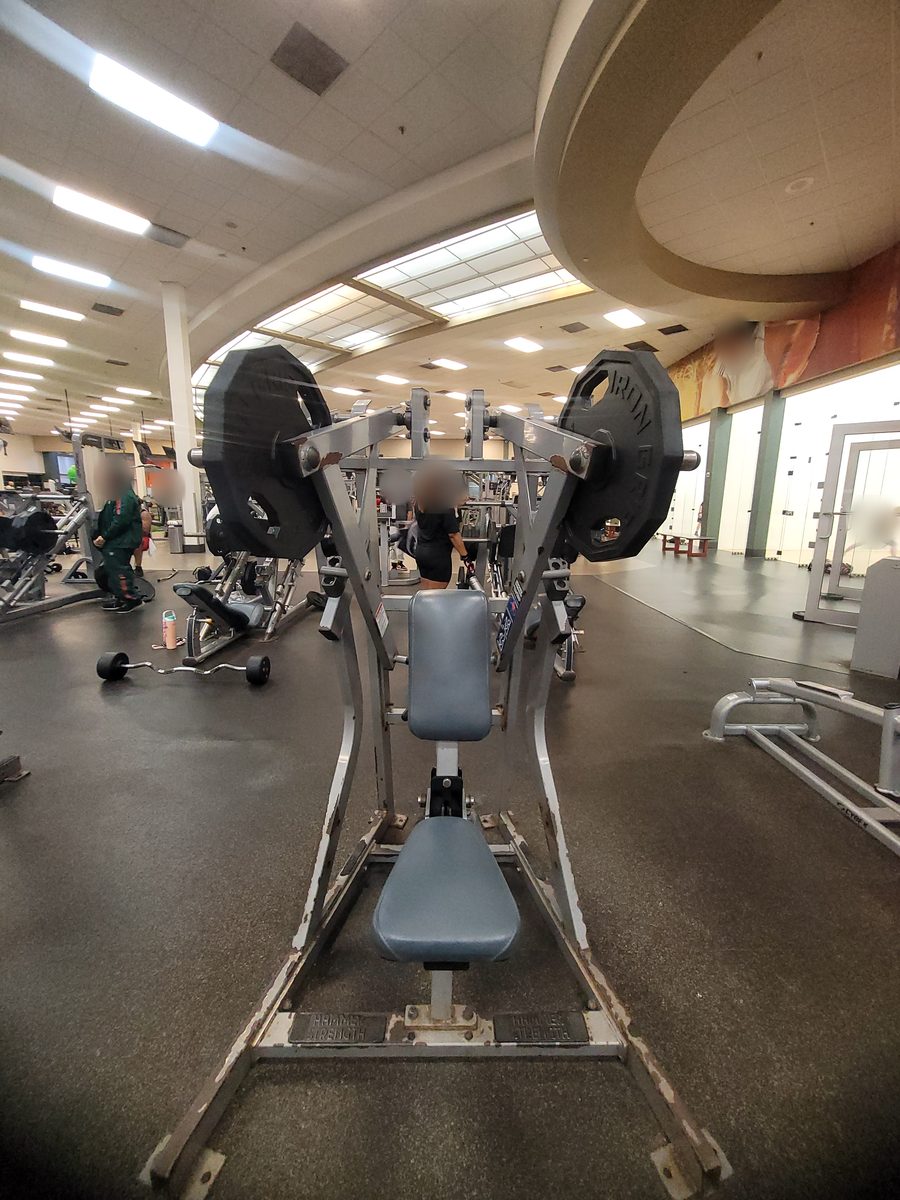 Plate-loaded Hammer Strength press machine on the weight floor at a Hollywood FL gym