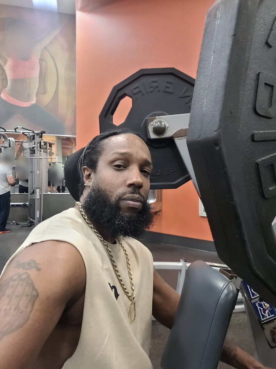 Unc Taylor seated on a plate-loaded machine during a machine-only workout over 40
